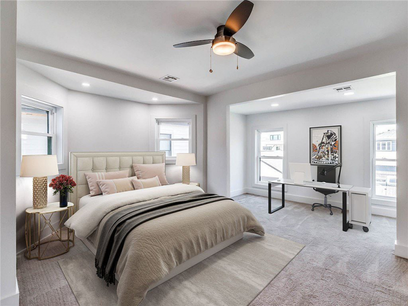 Primary bedroom with neutral and gray tones