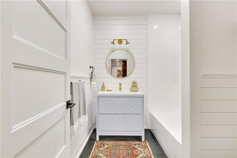 White bathroom with gold accents and hardware
