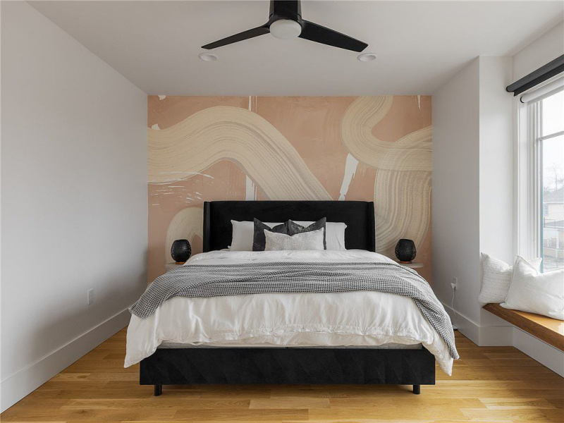 Bedroom with modern artwork accent wall