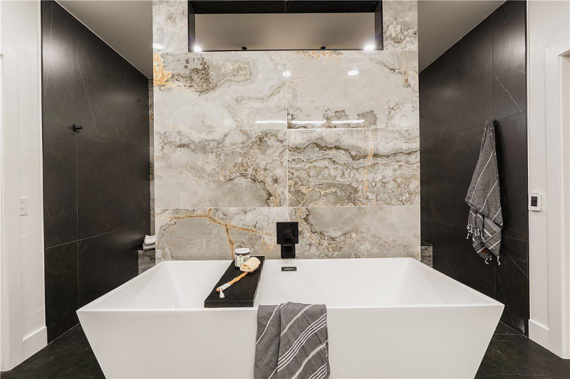 Spa bathtub with marble backsplash