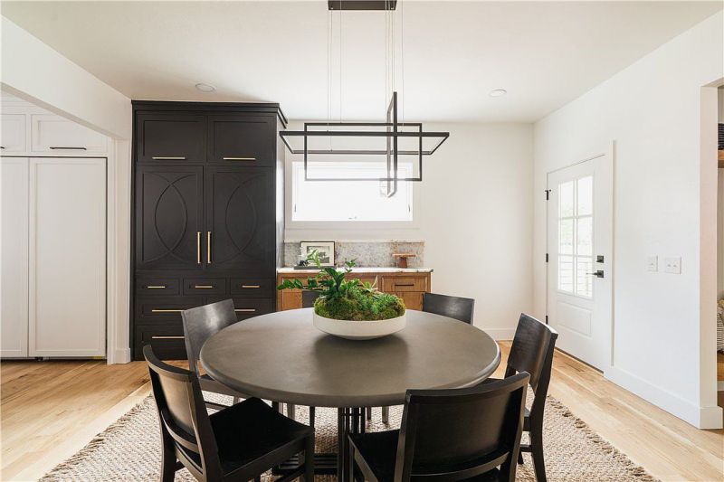 Dining area with custom black pantry cabinet