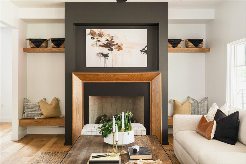 Black fireplace with wood trim