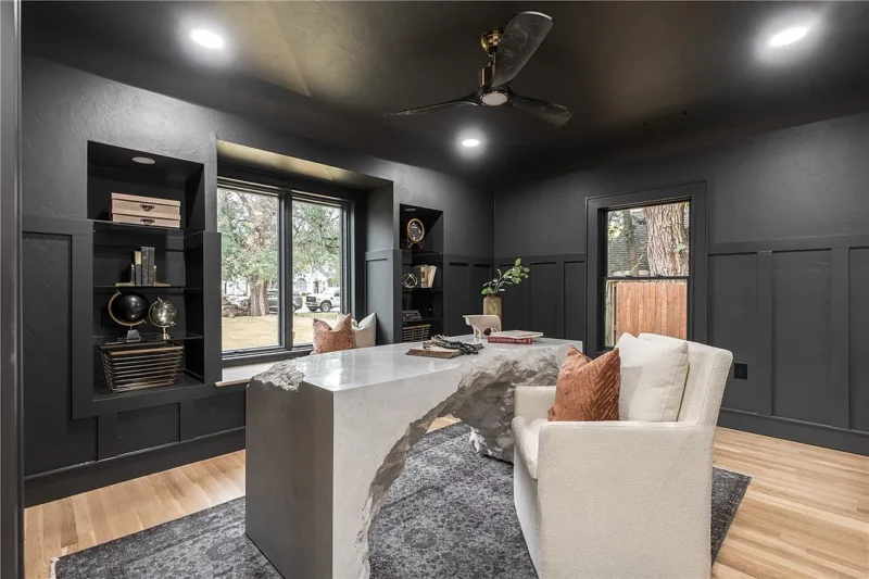 Office with black accent walls and ceiling
