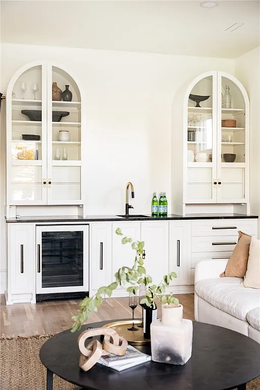 Luxury wetbar with arched built-in shelves
