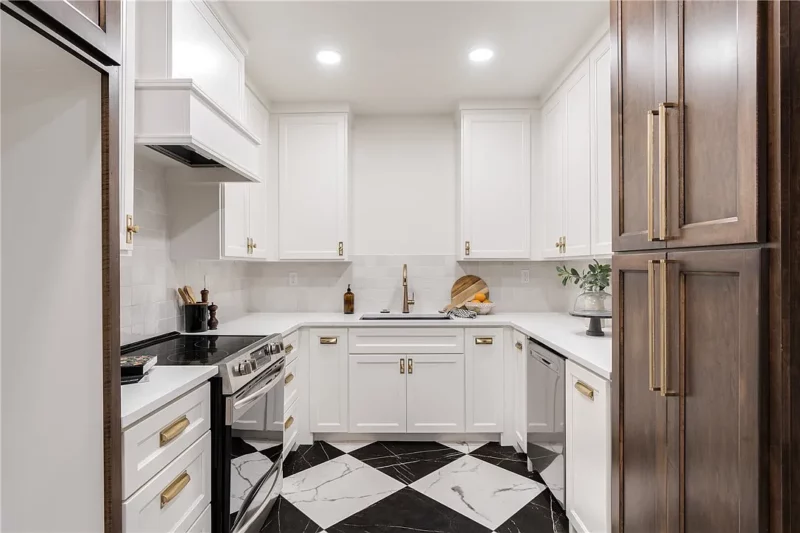 Butler kitchen with white cabinets and diamond pattern tiles