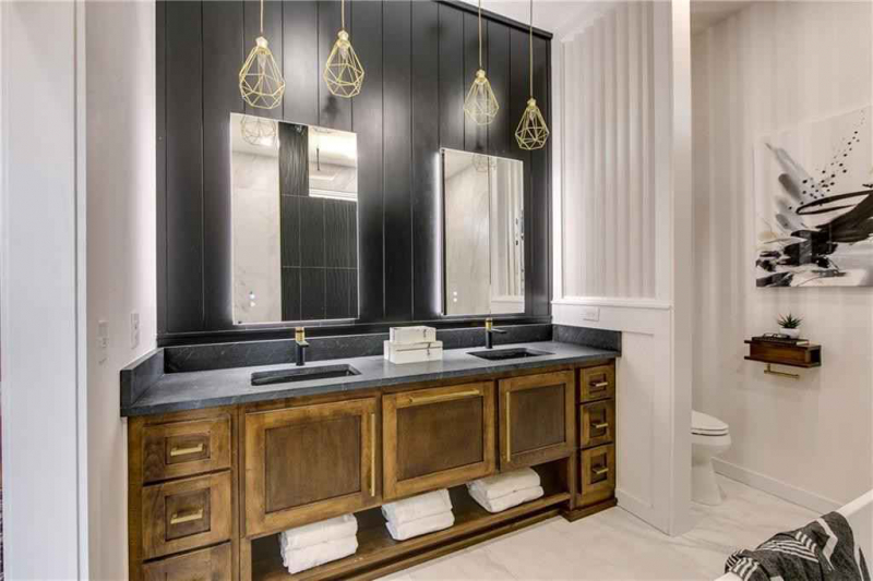 Rustic wood double vanity with black panel backsplash