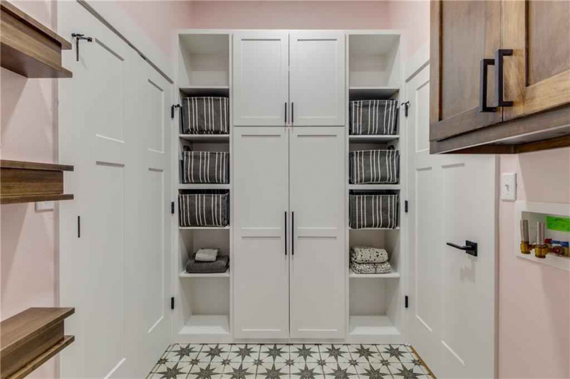 Laundry room storage system with both closed and open cabinets