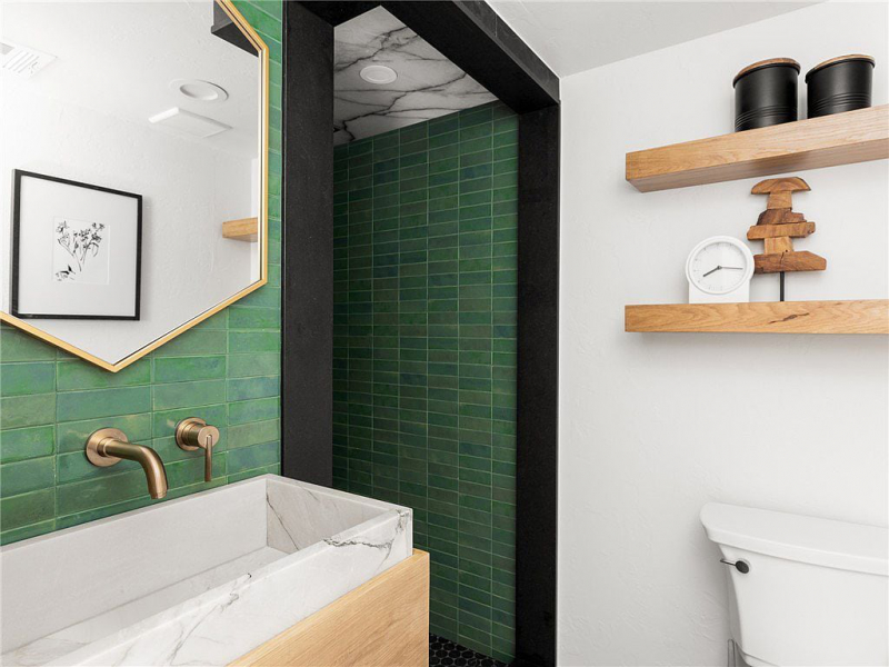 Shower with green subway tiles