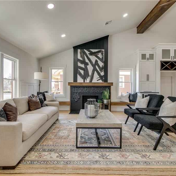 2729-nw-16th-st-26 Living area with angled roof and black fireplace